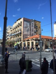 The busiest intersection in Jerusalem.  They coffee bar/bakery on the corner makes for good people watching and the great fresco wall mural across the street.