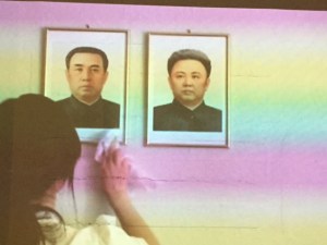 There were a number of video works in the show and this one had the soundtrack for the song.  It is portraits of Kim Jung Il and his son Kim Jung Un of North Korea.