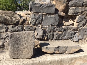 Carved images in the ancient synagogue, one very small in the middle of the right hand side and the lower foreground.