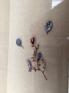 Repurposing the stems from a cluster of grapes using twined fabric.  