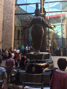 The Cadillac is from the 1940s and never driven.  There is an umbrella at the top of the boat behind the car that slowly opens and it rains inside the car.