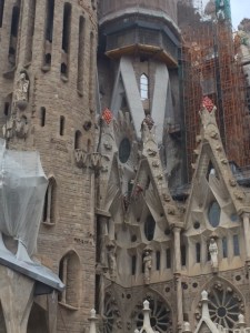 Notice the workers in red suits in the V between the two triangular shapes.