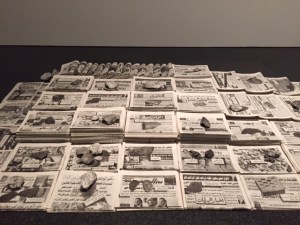 Francisco Ruiz, "Cairo Newstand", 2010, stacks of newspapers featuring propaganda related to the Arab Spring uprising.