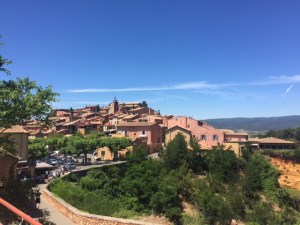 Ochre (from yellow to red to orange pigments) has been used since prehistoric times.  It was especially in demand in the 18th century for dying textiles and that's when this town was booming.  Now it's a tourist/artist haven.