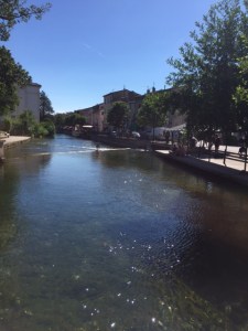 The open air market covers one side of the river and the restaurants and shops on the other.