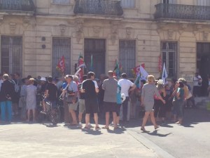A street demonstration of the communist party protesting the changes in work rules in France.  Many teachers in this group have job security but are in solidarity with others who do not.