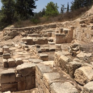 The synagogue has been identified by the elevated wall where the ark would be and the raised area called the bema (stage).  Unusual here is that this one faces West instead of East.