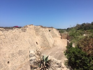 Old city port fortifications from Crusader times. You can see the walls and a moat below.