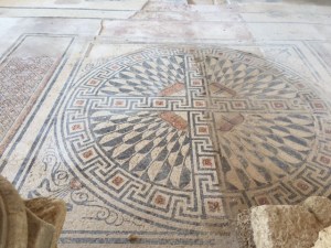 The bathhouse floor, half still visible, the other half destroyed.