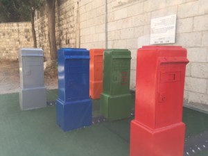 Across from the main post office in Jerusalem is this installation of old mailboxes. Shut and Yuvi Gerstein have set these up so that when you tap on the top of each box they make a specific sound and lights go on across the street on the main post office.
